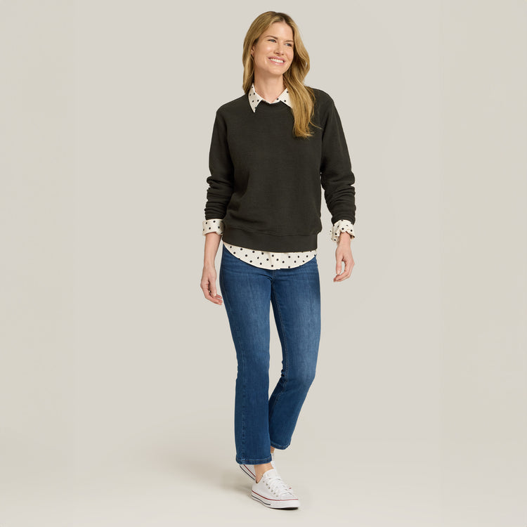 Women wearing Medium Blue High Rise Miniboot Ankle Logan Jeans