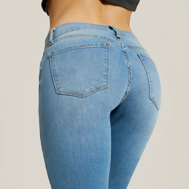 Women wearing Light Blue Mid Rise Slim Straight Logan Jeans