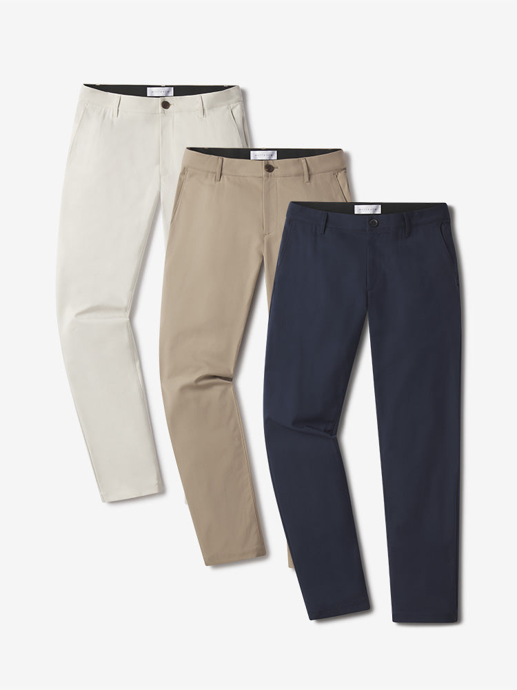 Men wearing Navy/Stone/Khaki 5 Pocket Travel Pants 3-Pack