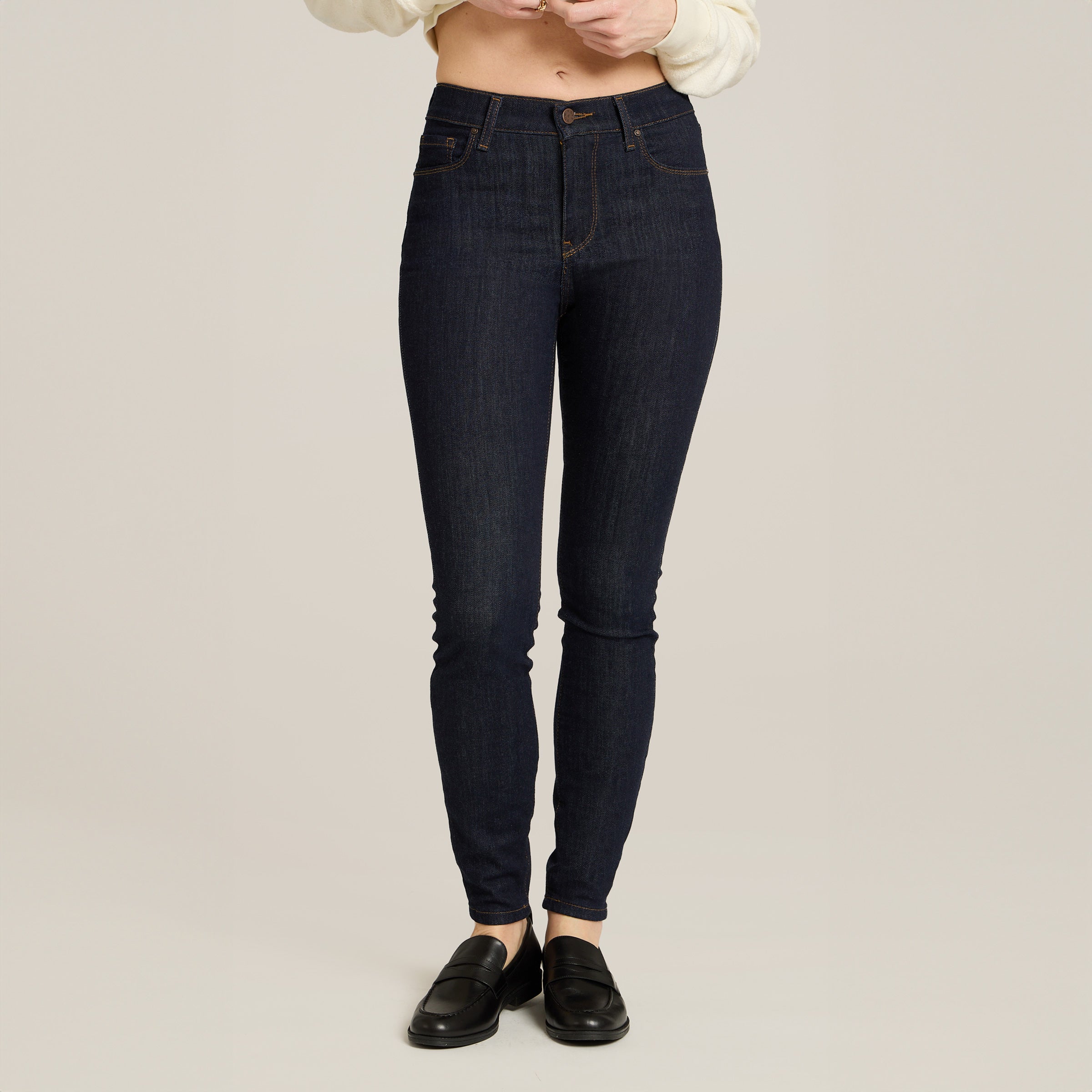 Women wearing Midnight High Rise Skinny Logan Jeans