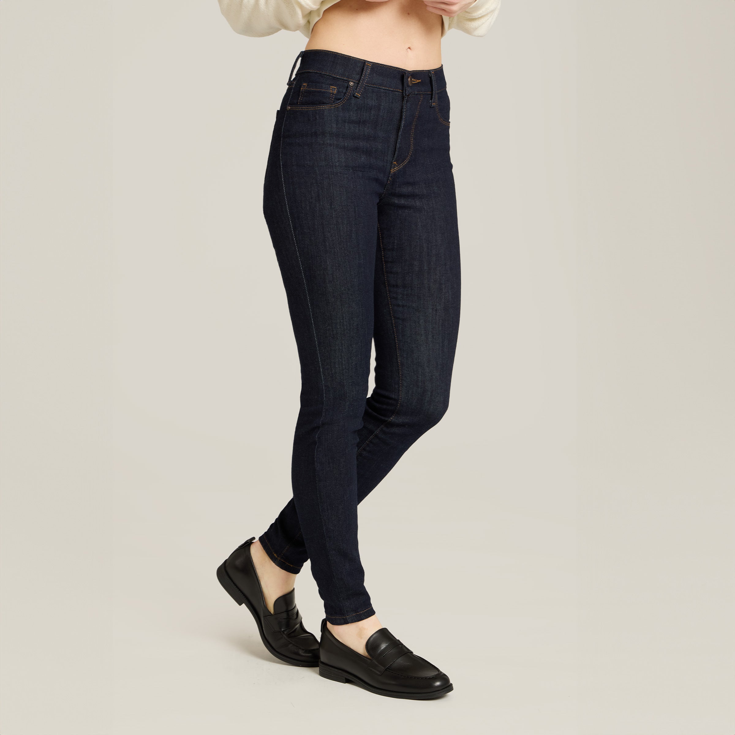Women wearing Midnight High Rise Skinny Logan Jeans