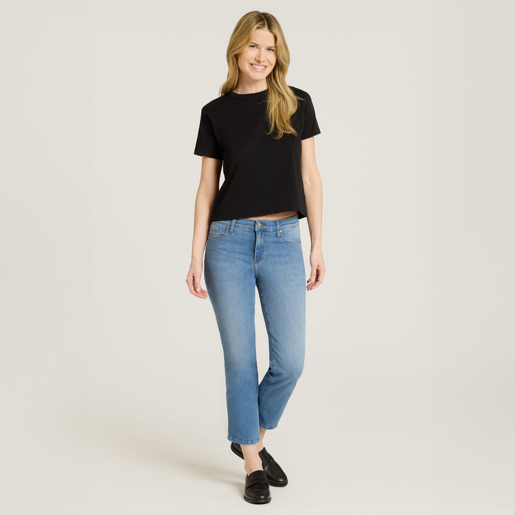 Women wearing Light Blue Mid Rise Slim Cropped Leg Logan Jeans