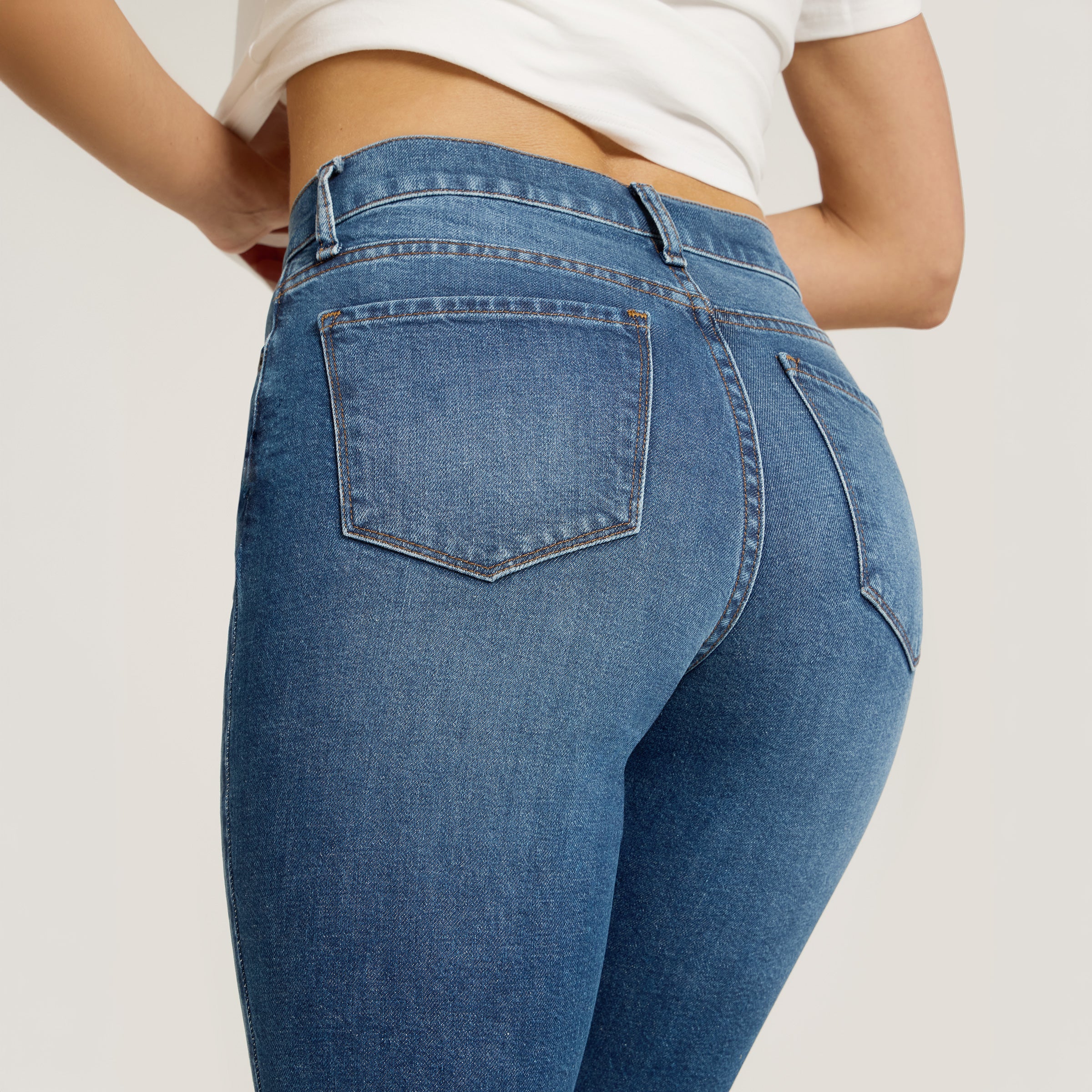 Women wearing Medium Blue High Rise Mom Ridge Jeans