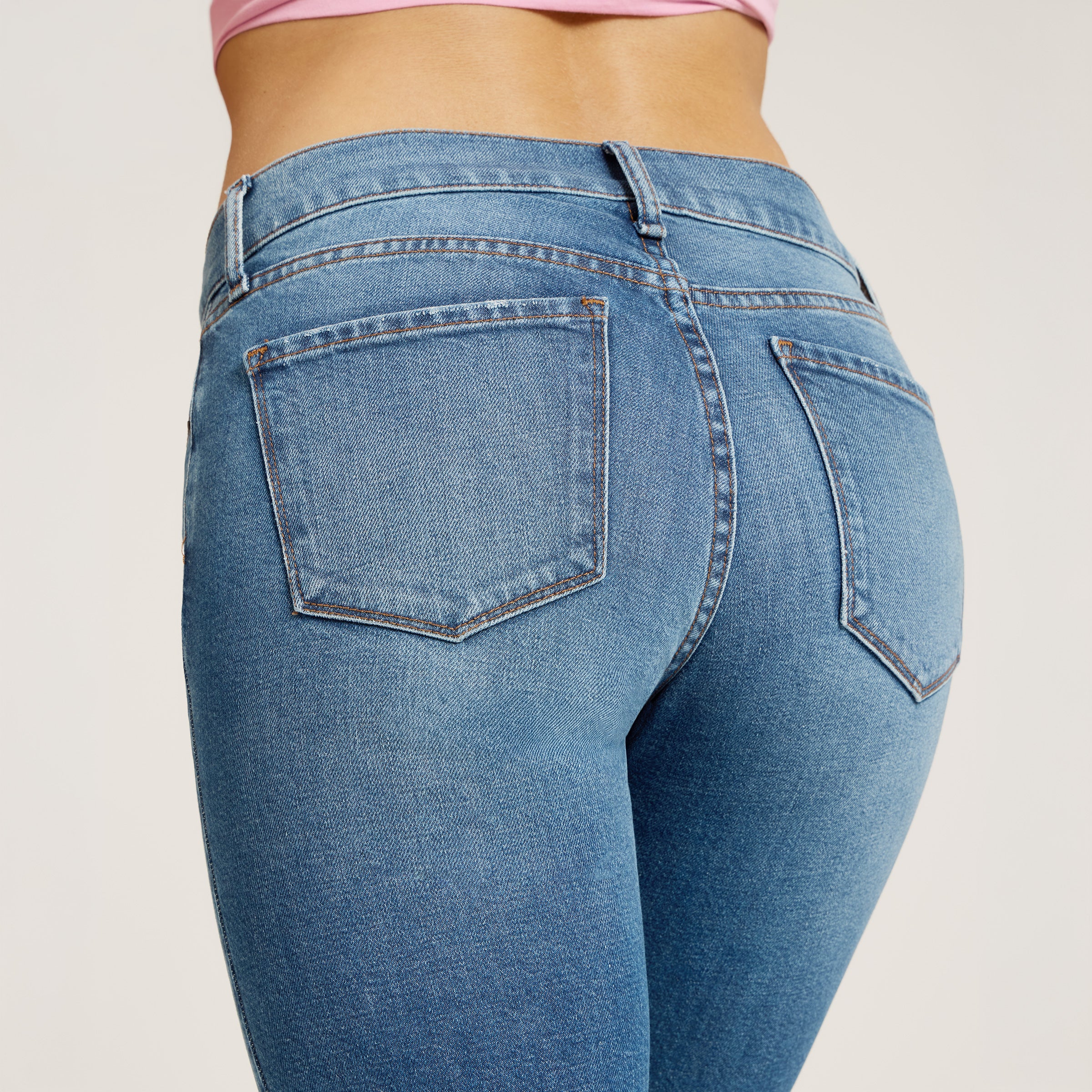 Women wearing Light Blue Mid Rise Slim Straight Ridge Jeans