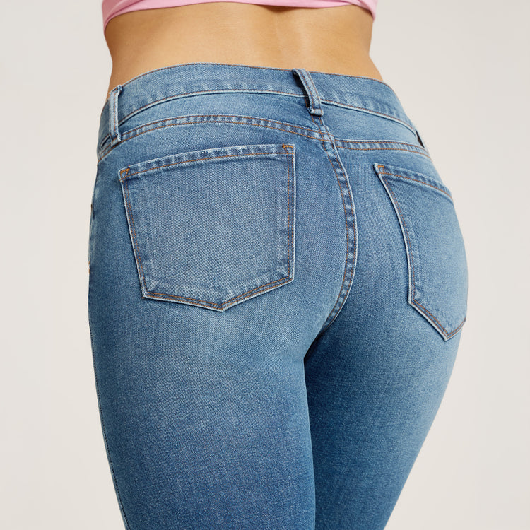 Women wearing Light Blue Mid Rise Slim Straight Ridge Jeans