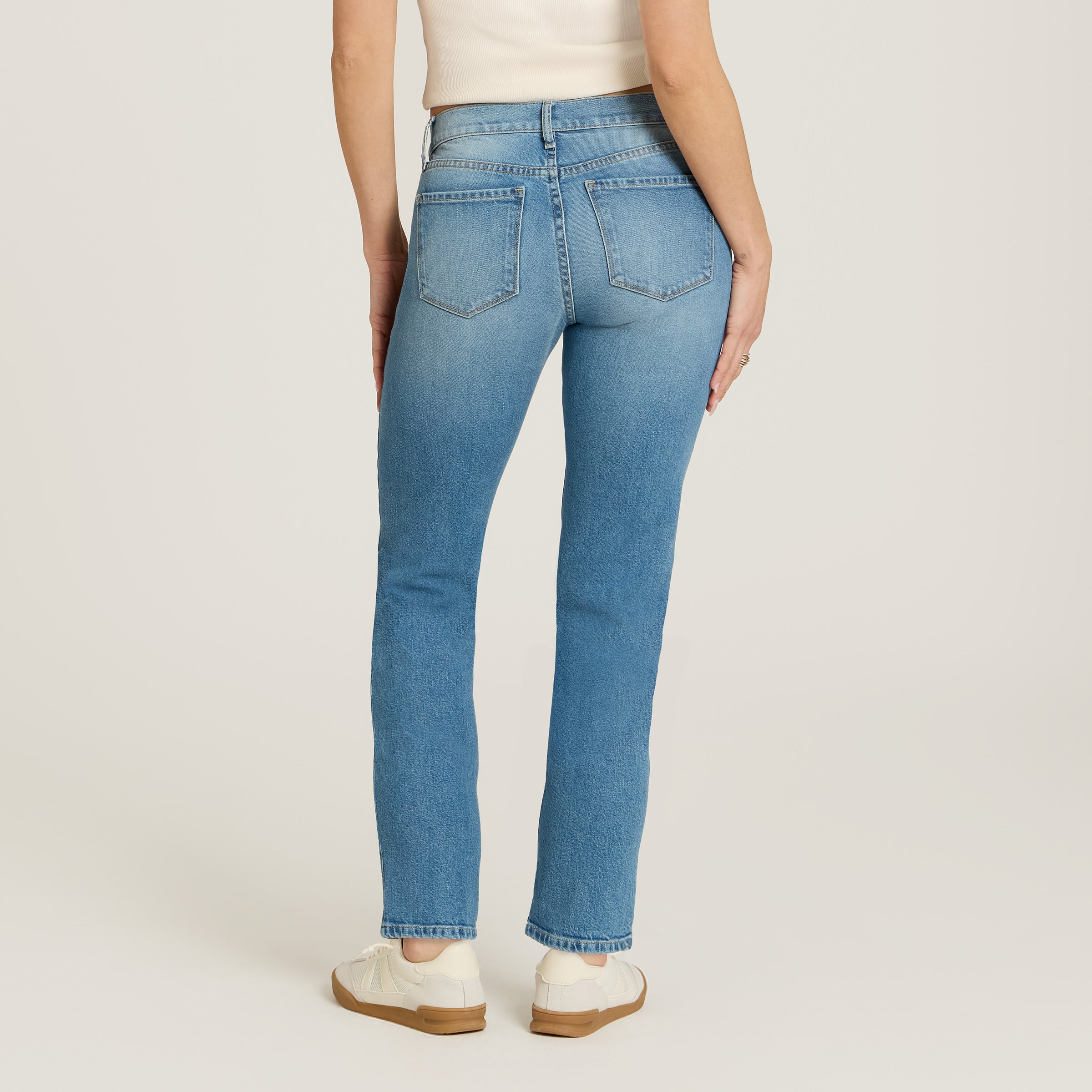 Women wearing Washed Out Blue Mid Rise Slim Straight Ridge Jeans