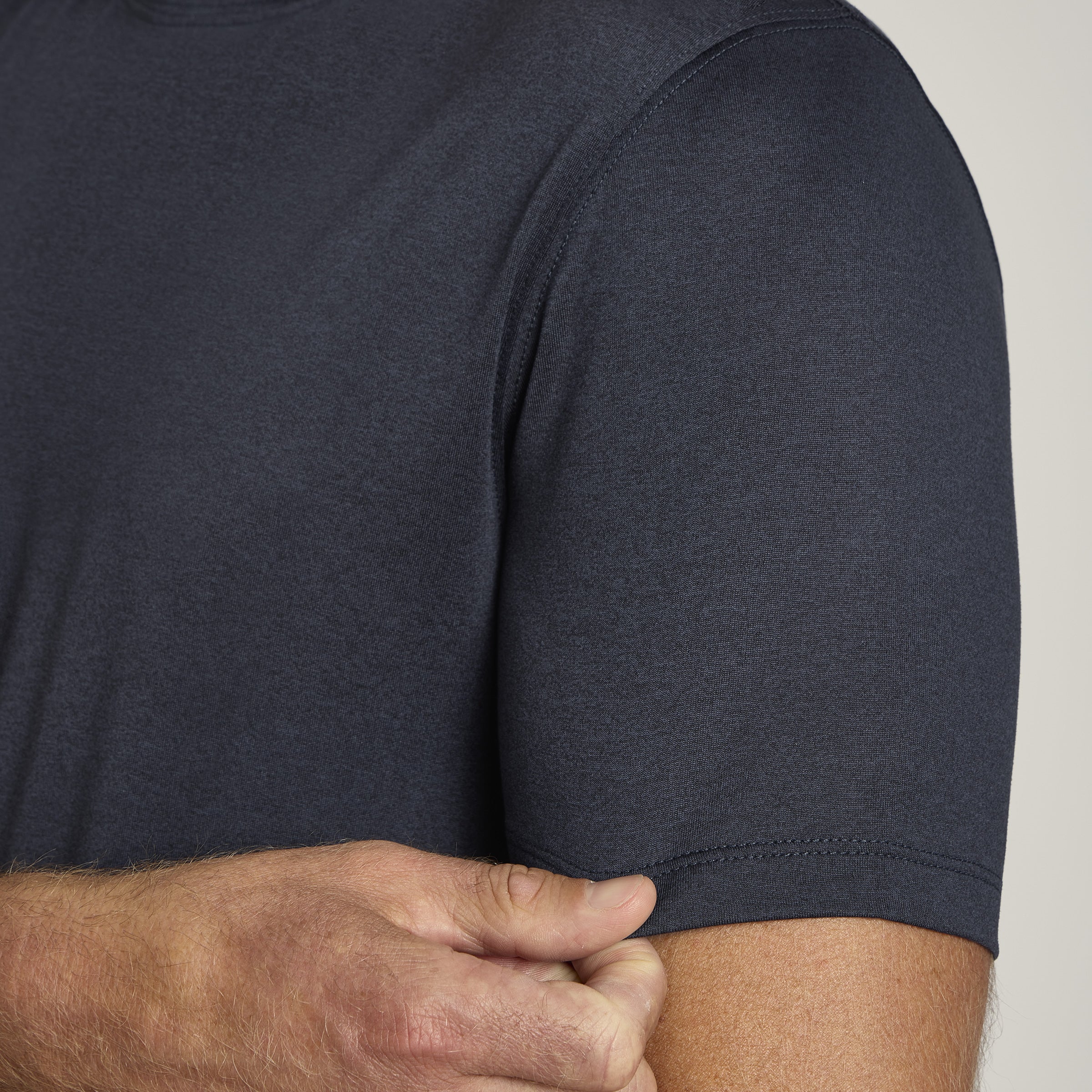 Men wearing Navy Heather Tech Tee