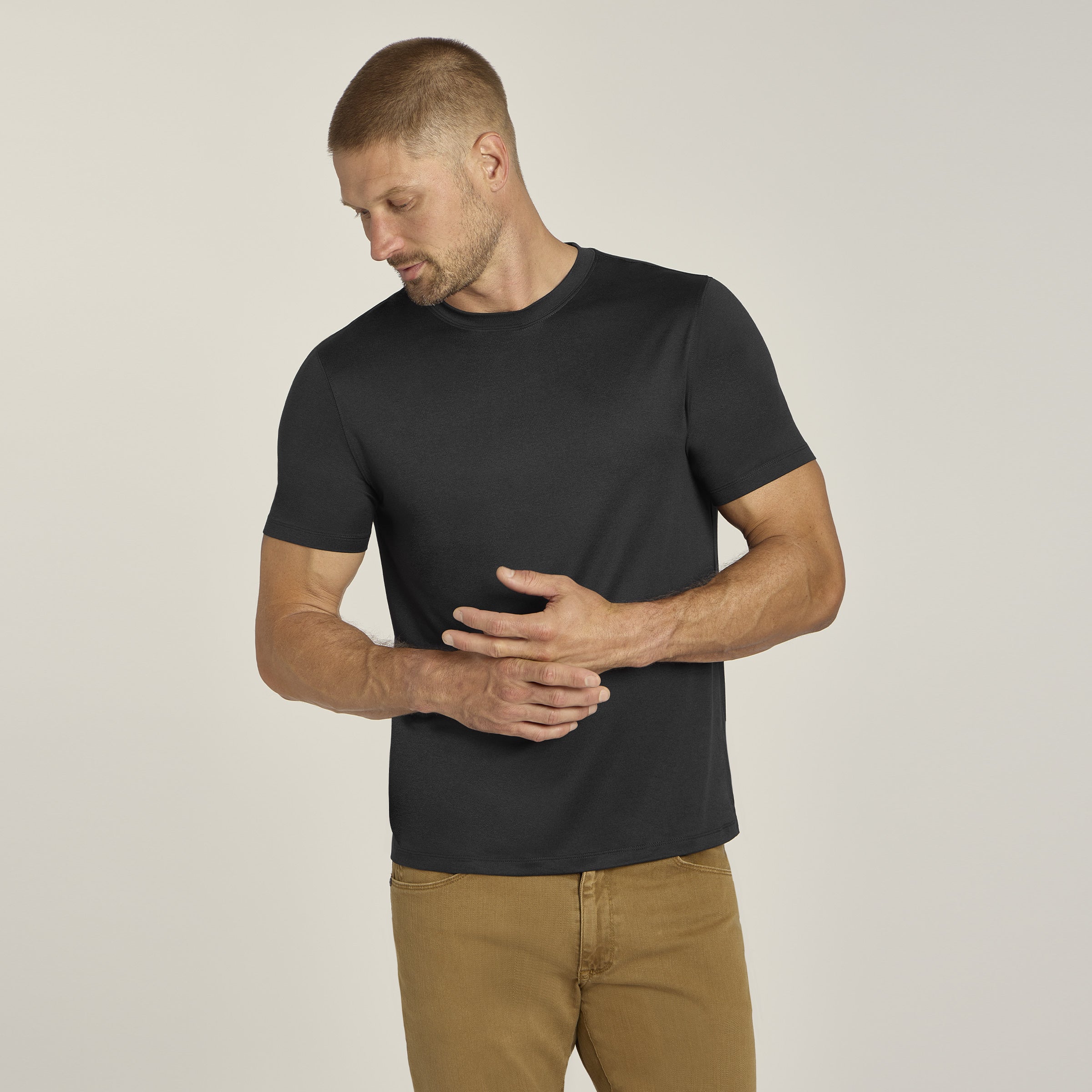 Men wearing Black Heather Tech Tee