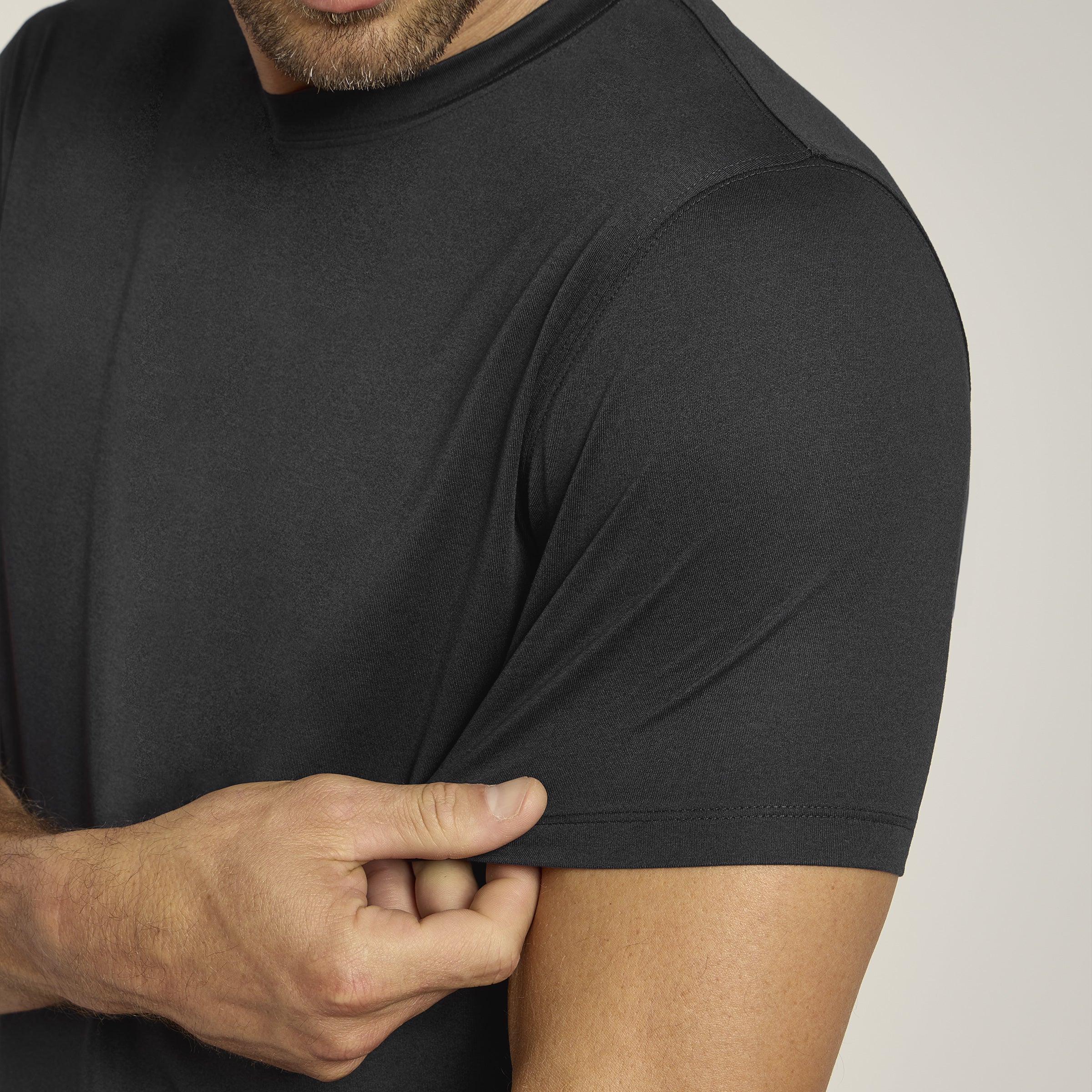 Men wearing Black Heather Tech Tee