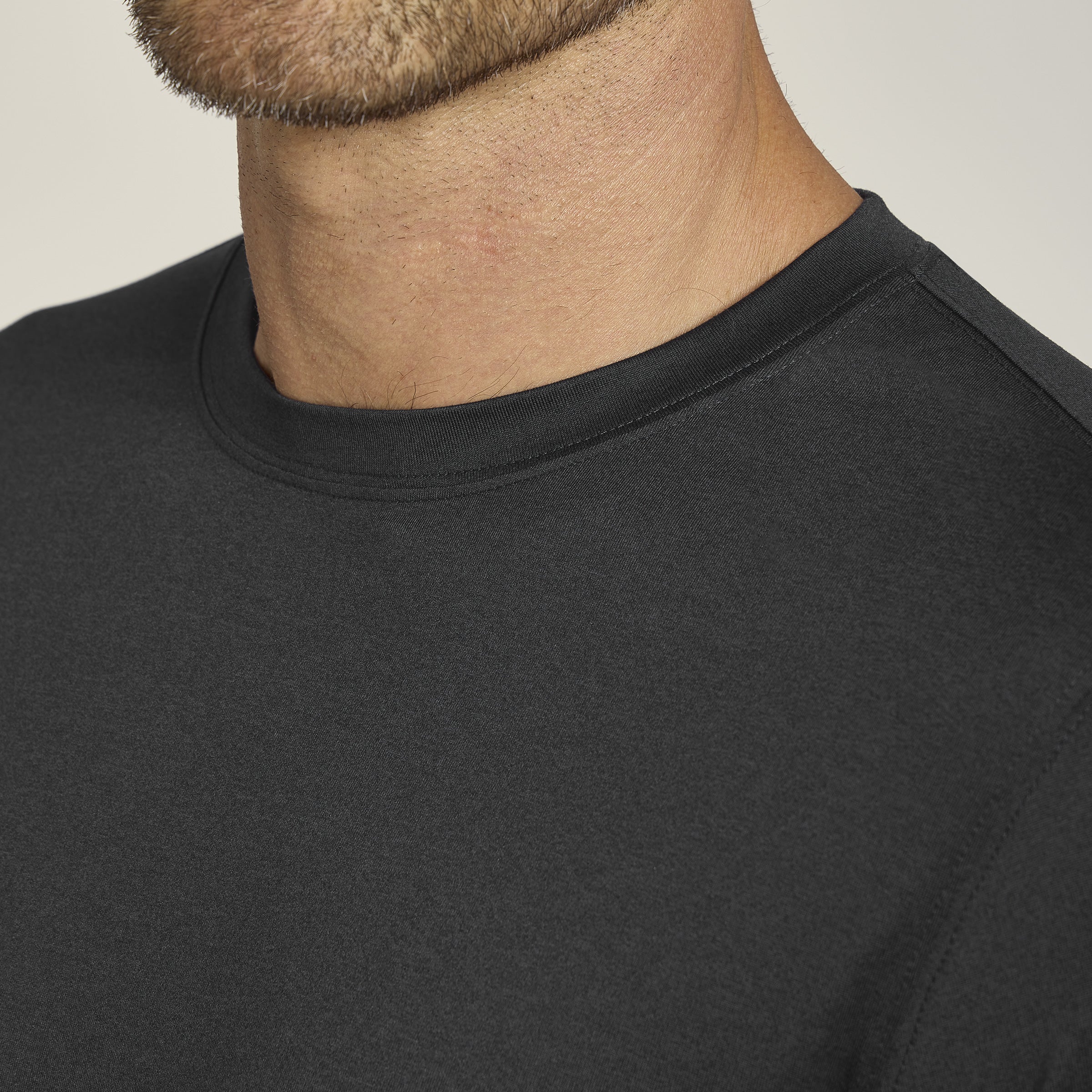 Men wearing Black Heather Tech Tee