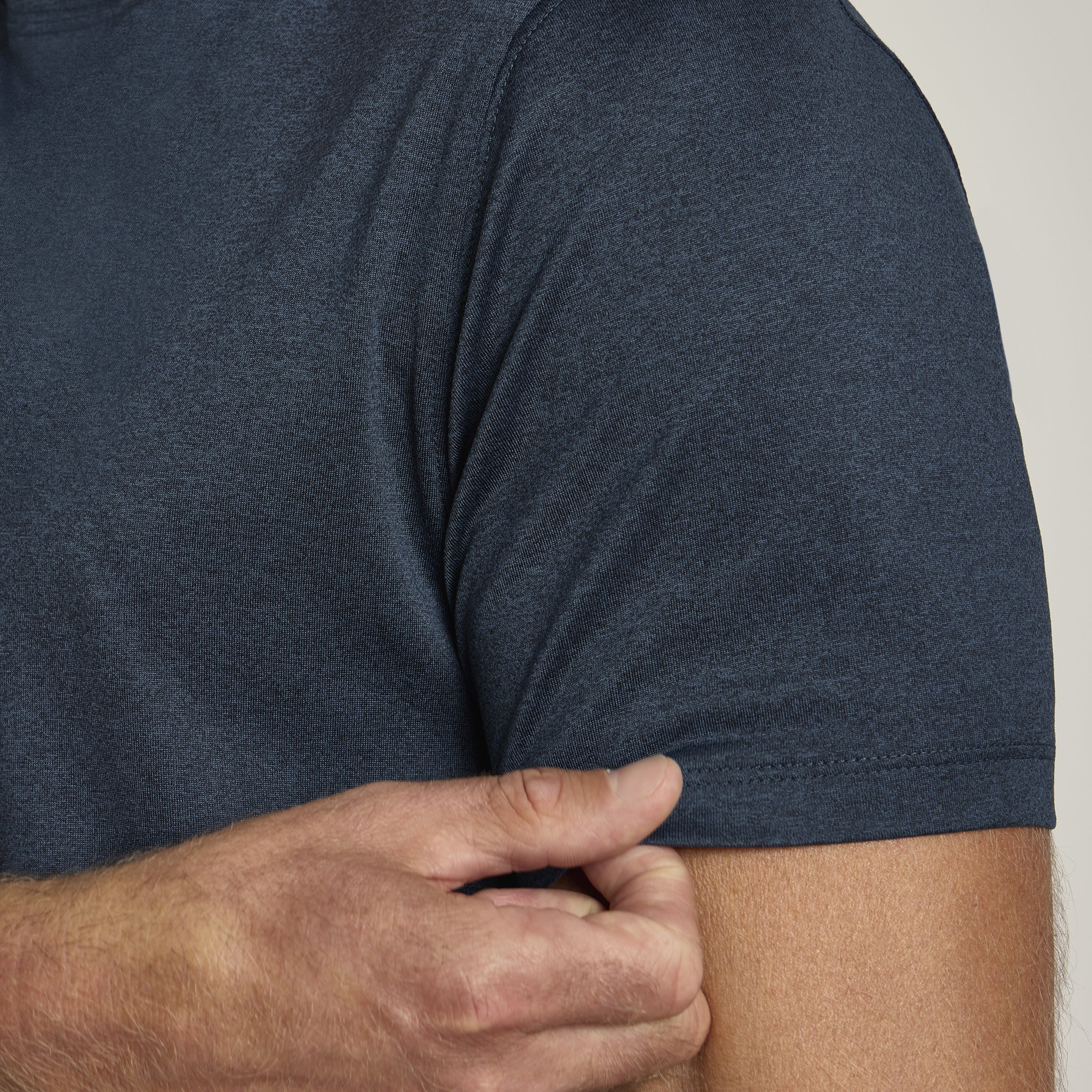 Men wearing Teal Heather Tech Tee