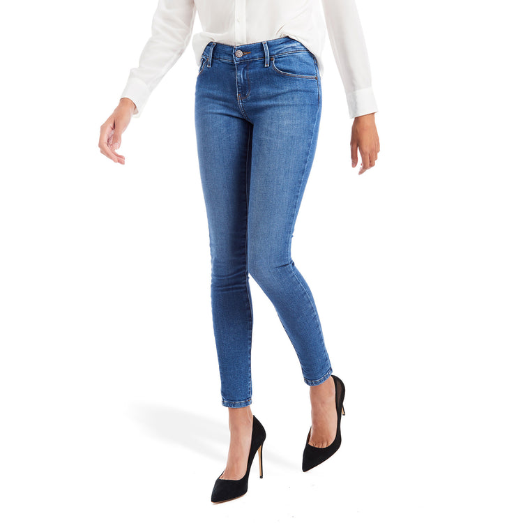 Women wearing Light/Medium Blue Mid Rise Skinny Beekman Jeans