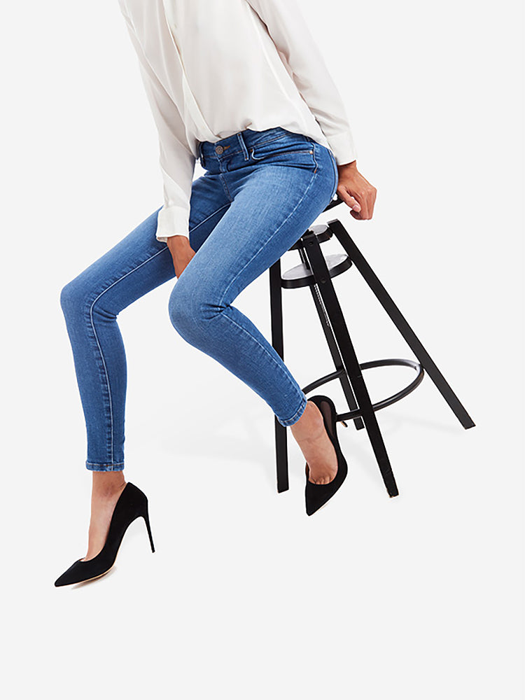 Women wearing Light/Medium Blue Mid Rise Skinny Beekman Jeans